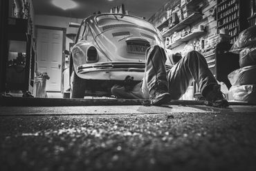 Mechanic with customer at their vehicle