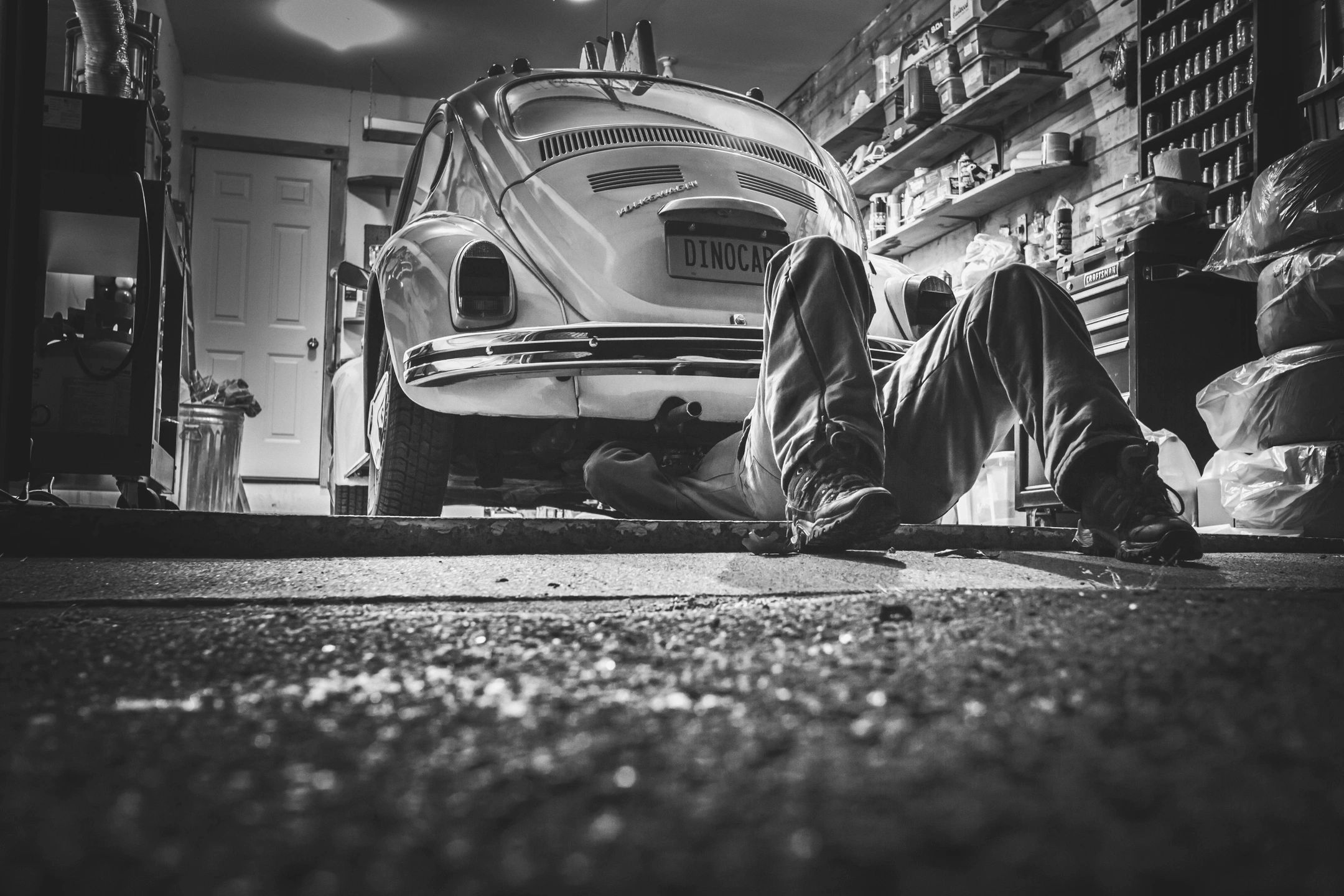 Mechanic under VW Beetle